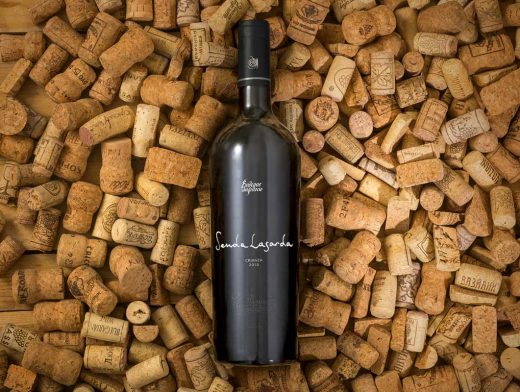 Realistic Wine Bottle PSD Mockup On Cork Pile